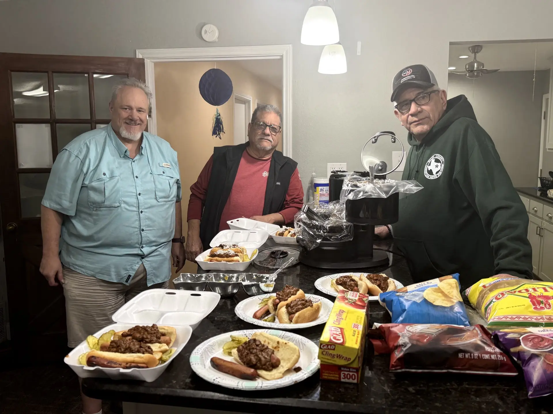 Job Corps mentors serving a meal together in the church kitchen