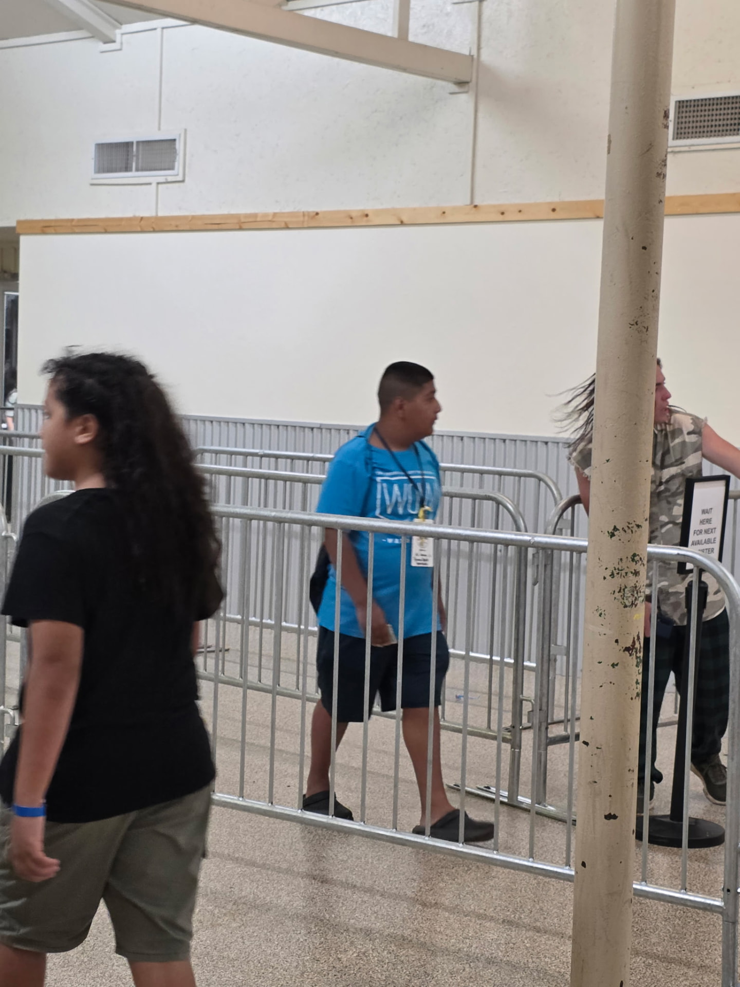 Students lining up for an activity in the camp recreation hall